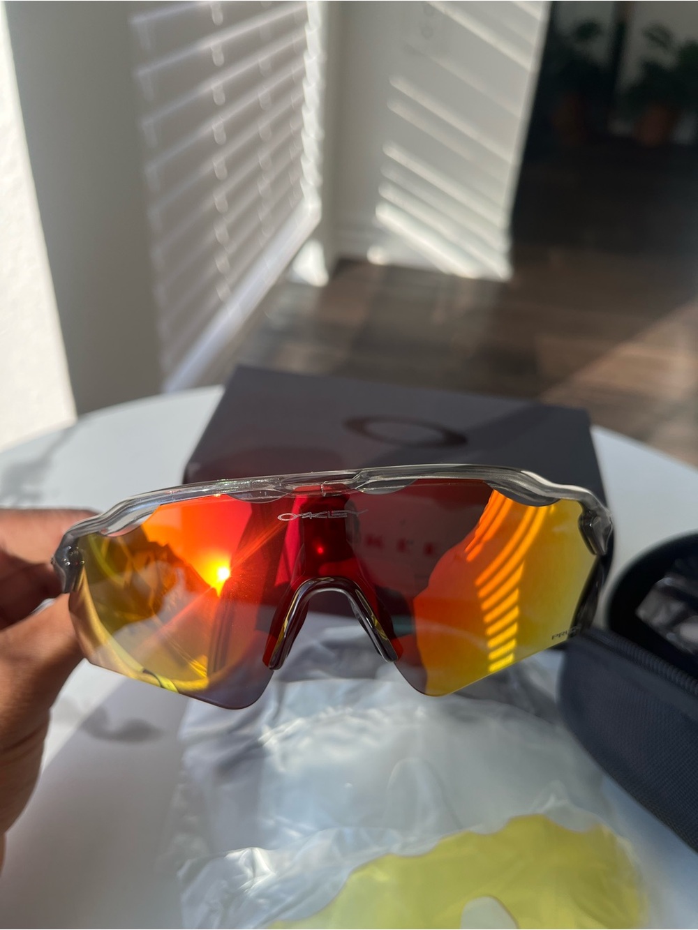 Oakley Clear Frame Sport Sunglasses with Red-Orange Mirror Lenses